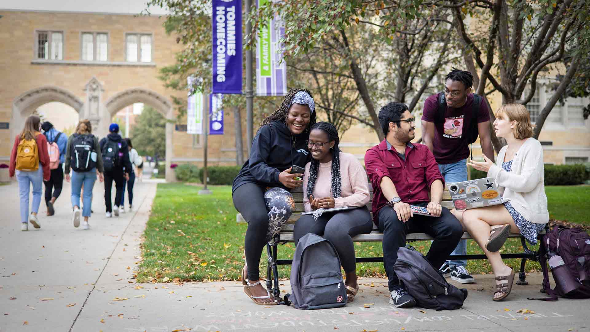 Students sitting on bench
