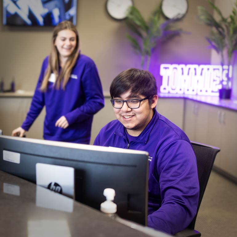Student working at front office desk
