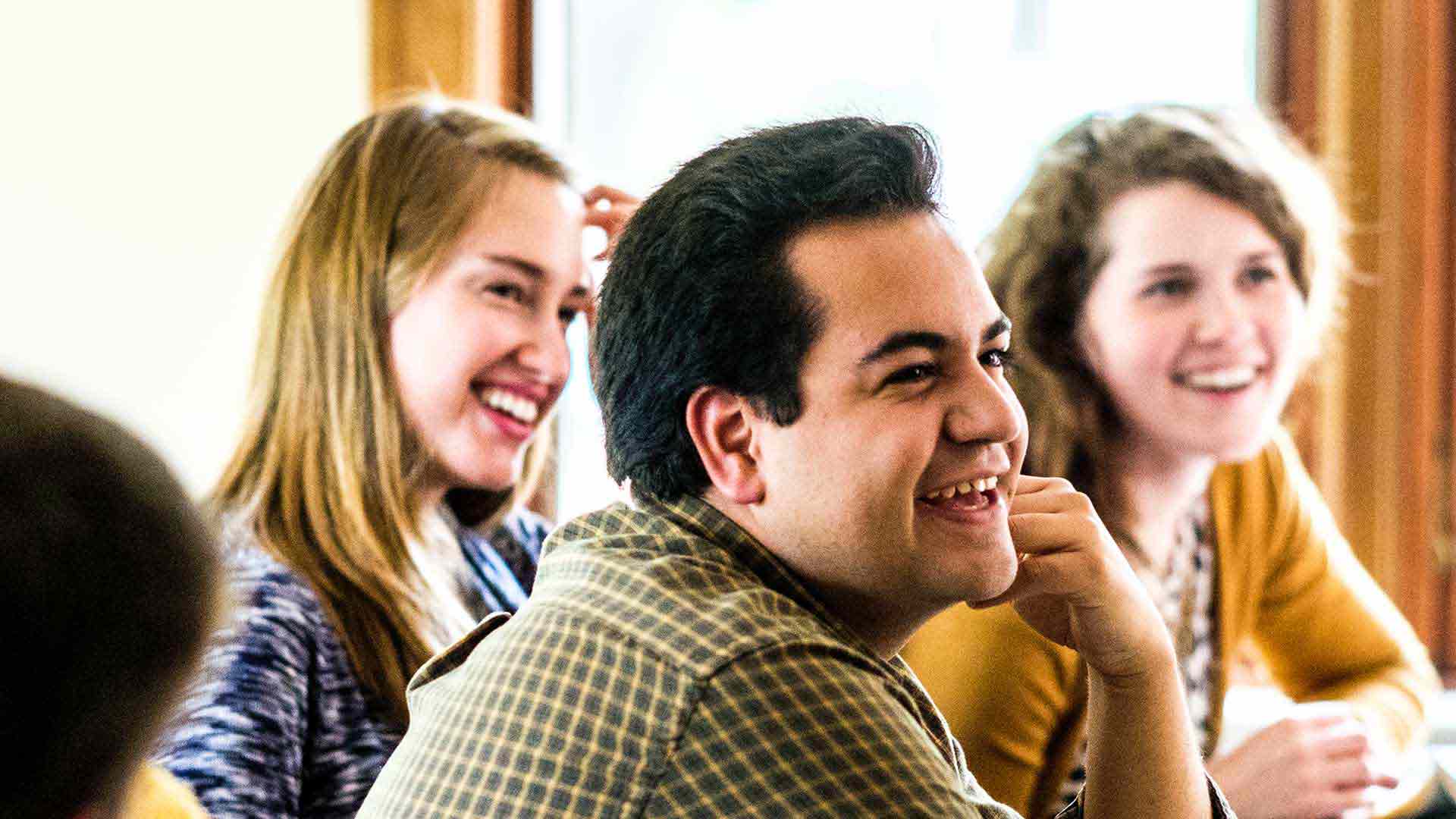 University of St. Thomas students laugh during a class.