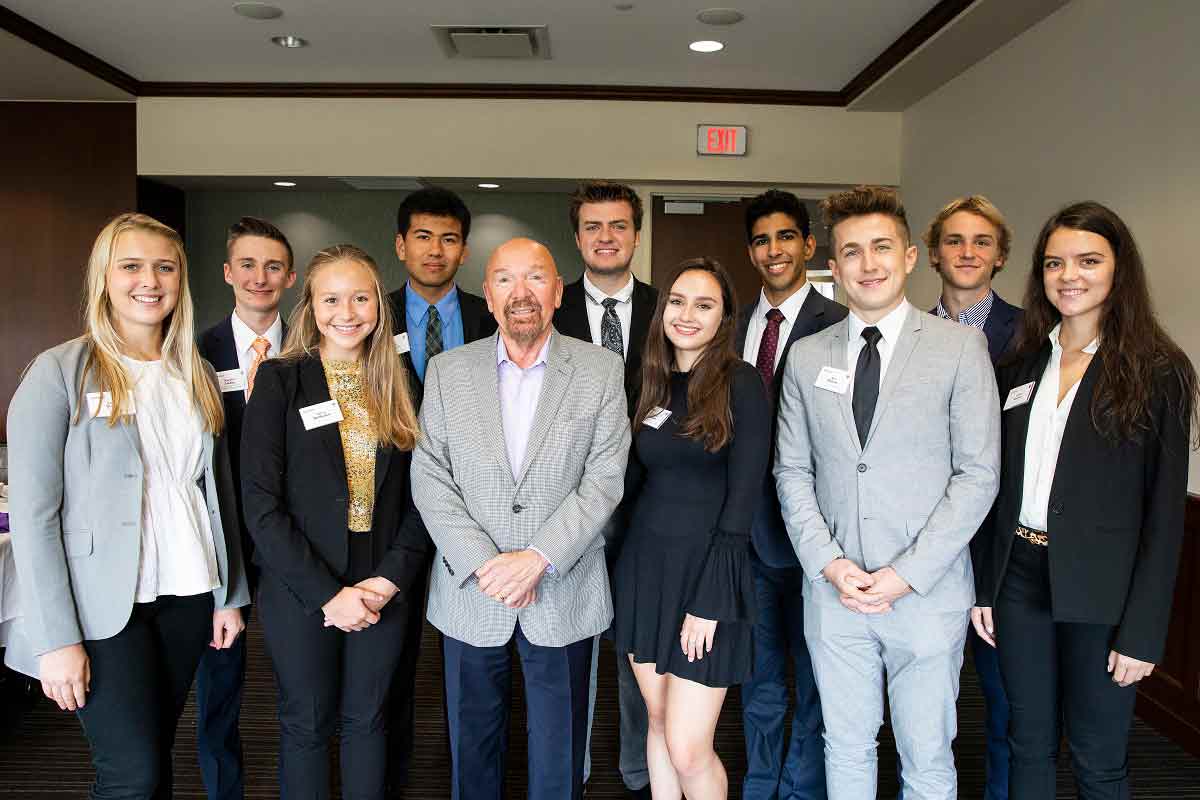 Ten Schulze Innovation Scholars pose for a photo with Dick Schulze.