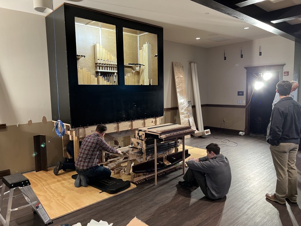 Builders installing Lewtak pipe organ