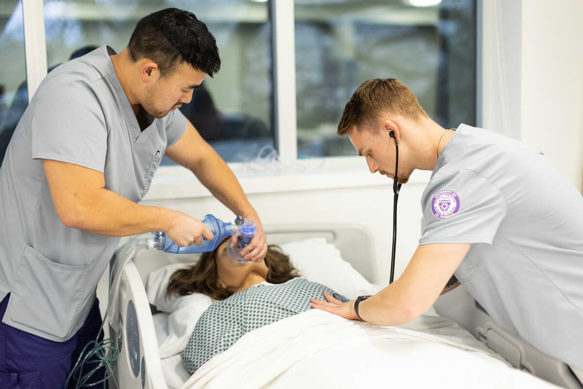 Students caring to simulation patient dummy