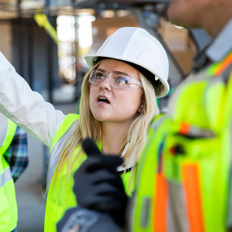 Student Chloe Weber tours a soccer stadium while under construction.