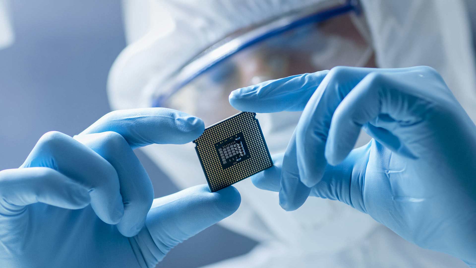A CPU chip is examined in a lab.