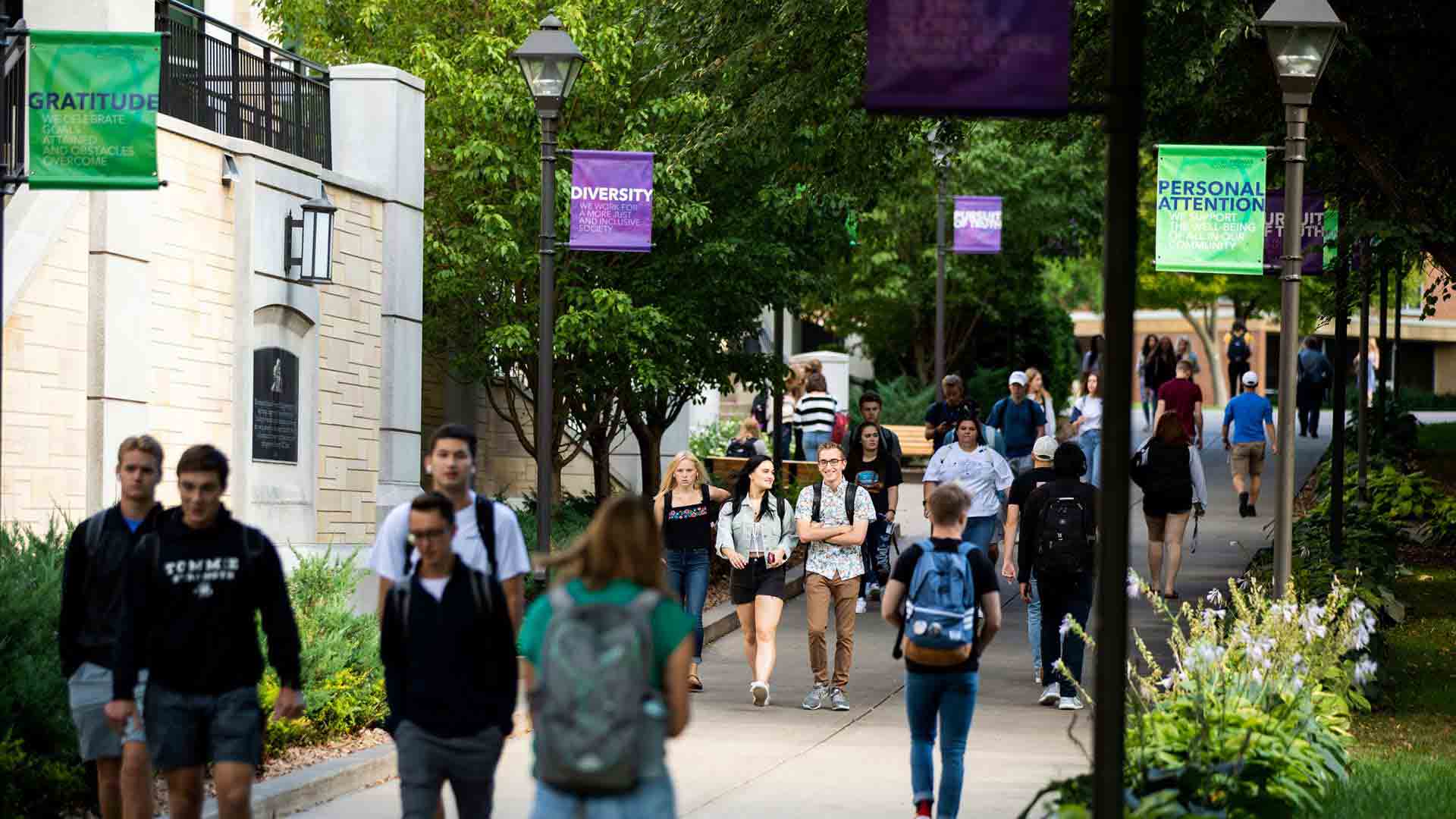Students walk from the upper quad to the lower quad.