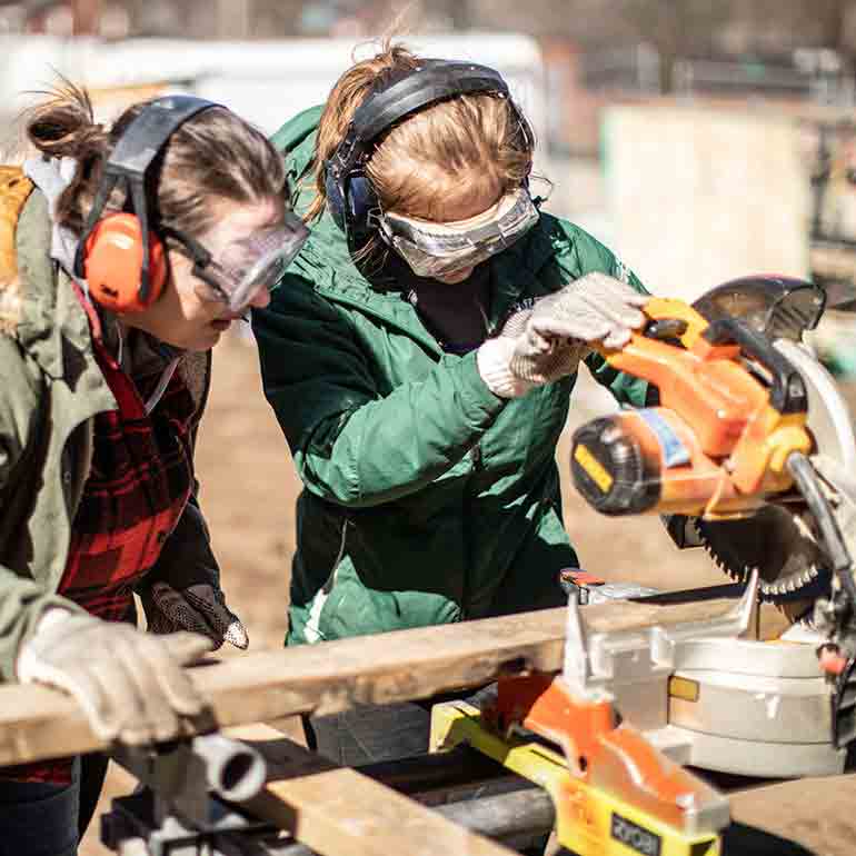 Students volunteer on a Habitat for Humanity Women Build house project