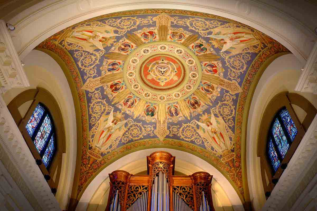 Ceiling artwork and organ inside The Chapel of St. Thomas Aquinas.