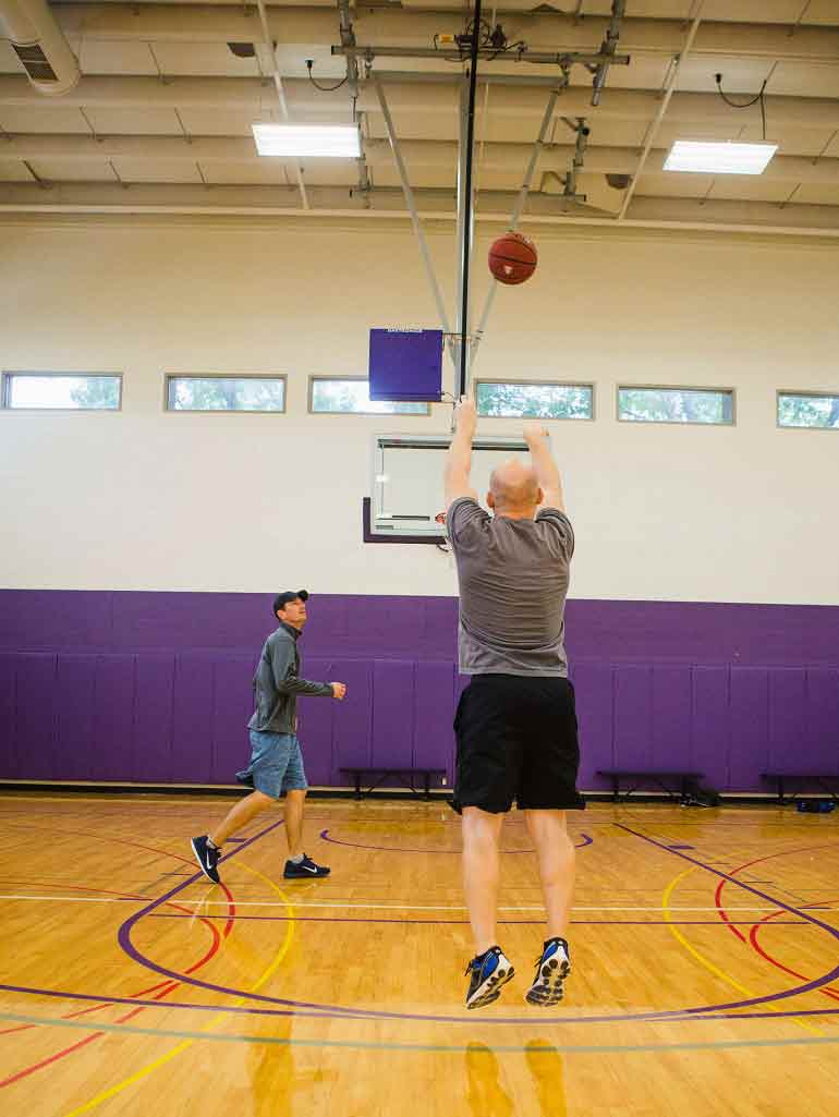 Two students playing basketball in a Physical Education Class in McCarthy Gym gym on Saturday, September 29, 2018.