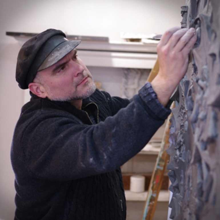 sculptor Timothy Schmalz at work in the studio
