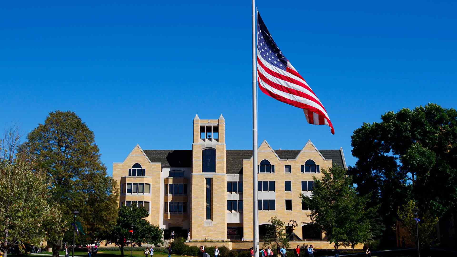 The American flag is prominent in front of the O'Shaughnessy Library on North Campus.