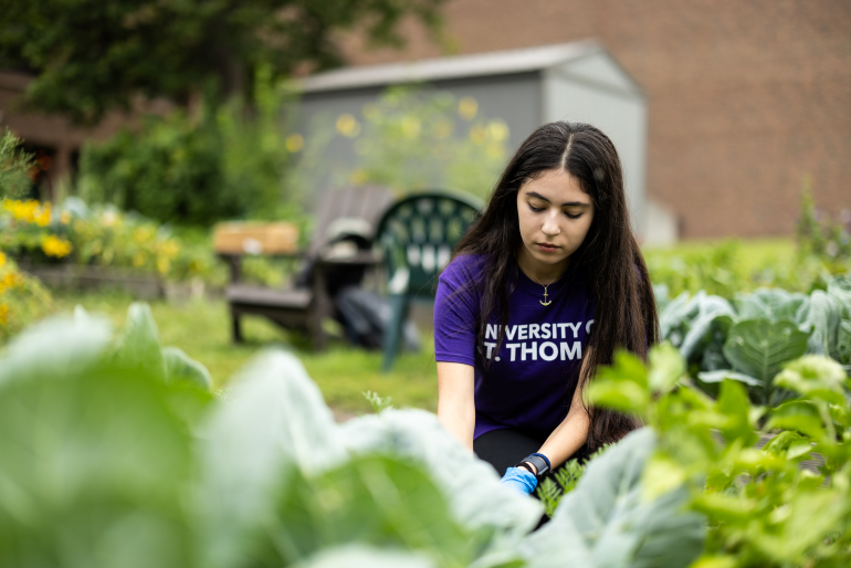 student planting/gardening