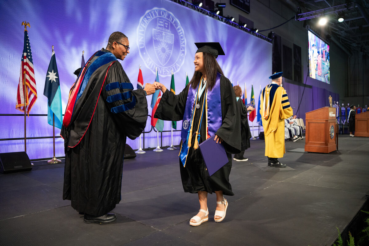 Student shaking hands at graduation ceremony