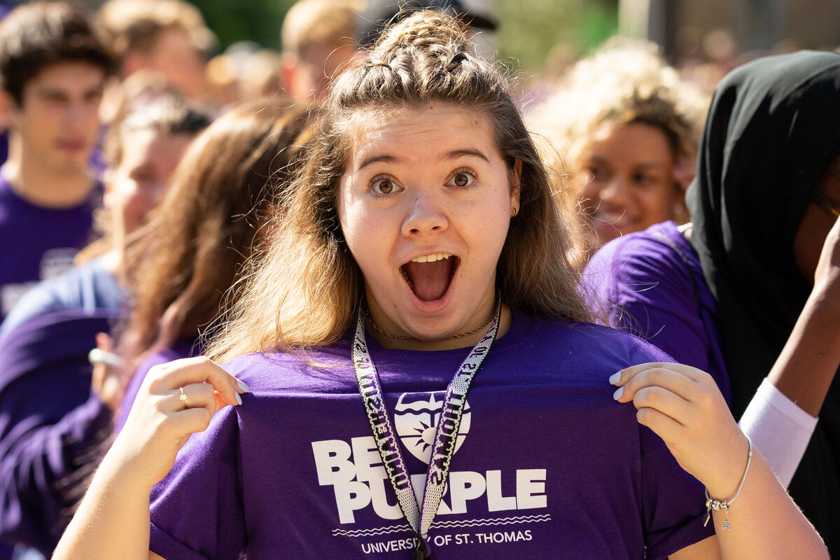 Student wearing a shirt that says Be Purple
