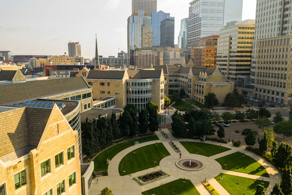 Aerial view of the Minneapolis campus with the downtown Minneapolis skyline in the background.