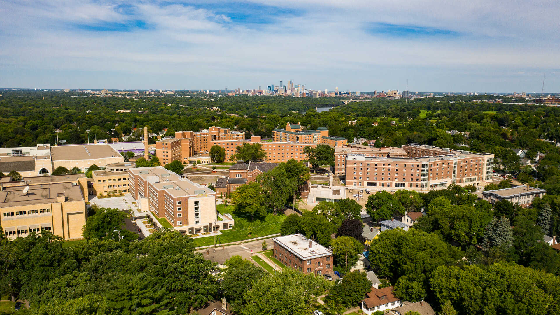 aerial view of the St Thomas campus against the Minneapolis skyline