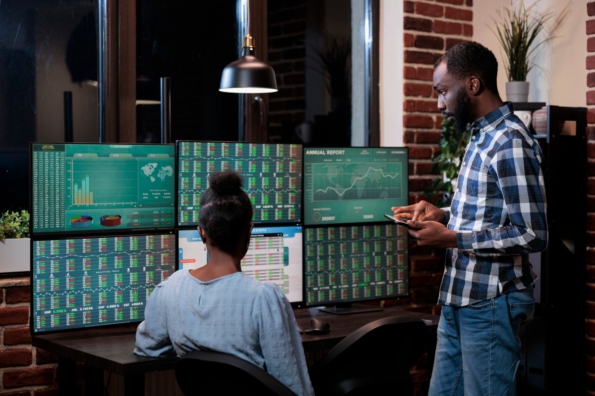 Financial professionals looking at data